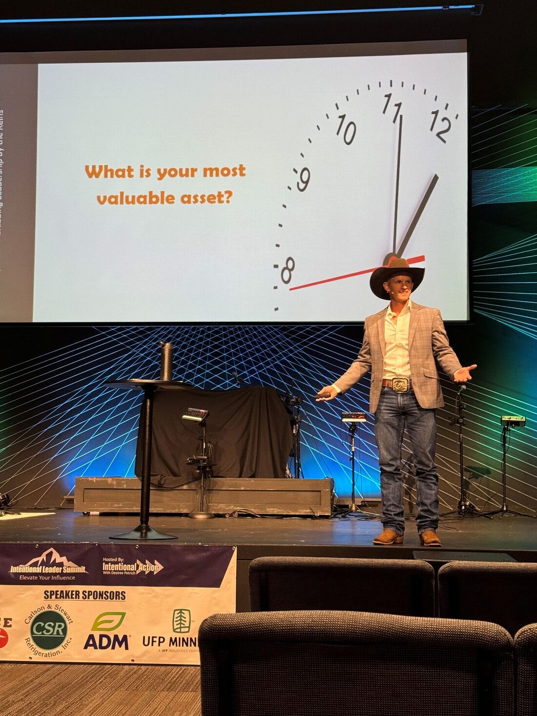 Jon Anderson speaking on stage at the Intentional Leader Summit